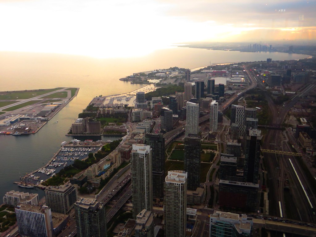 Aerial view from the CN Tower of Queens Quay and high-rise towers along Toronto's waterfront on Lake Ontario.